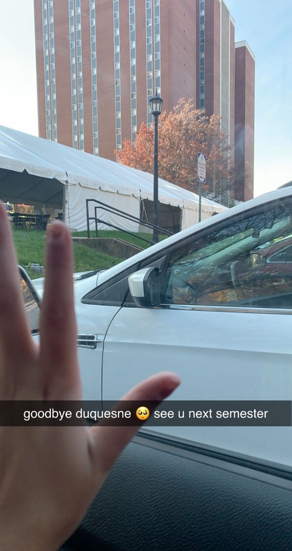 SnapChat screenshot of Duquesne building and hand waving goodbye.  In-picture text reads "goodbye Duquesne see u next semester".