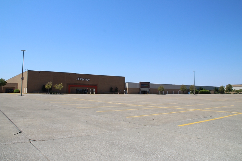 Photo of an empty store parking lot.