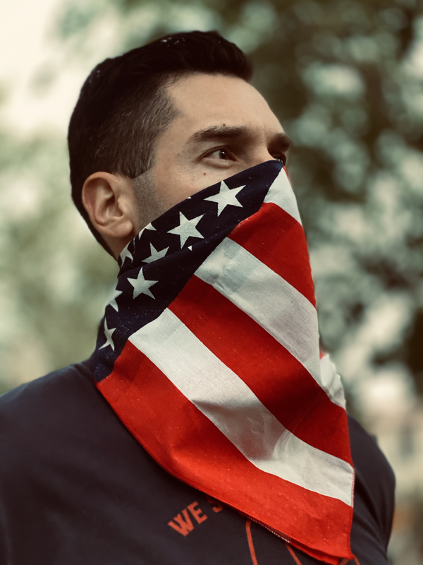 A person with an american flag mask. 