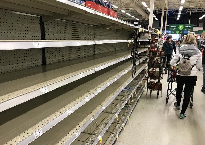 Image of an empty grocery store shelf.