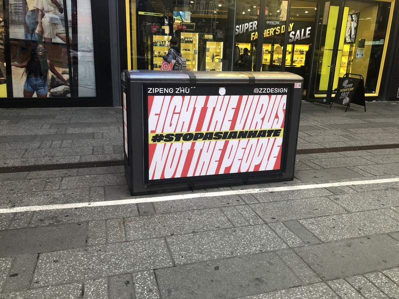 This is a picture of a sign that reads "Fight the virus not the people, #stopasianhate".