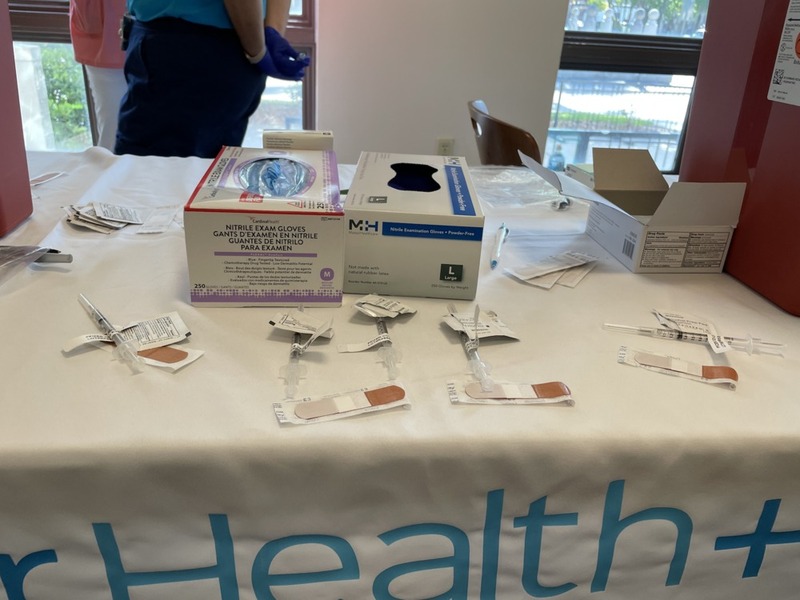 This is a picture of vaccine supplies that have been laid out on a table. 