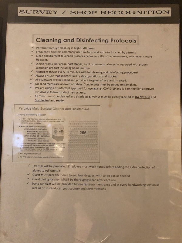 A poster listing cleaning and disinfecting protocols. 