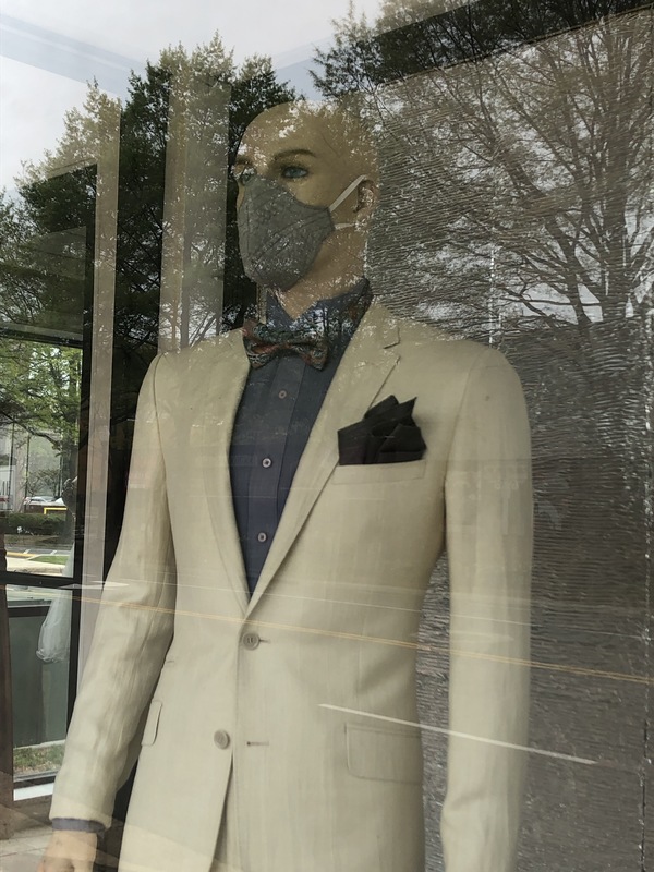 A mannequin with a mask on. 