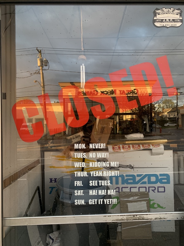 A closed sign on a glass door. 