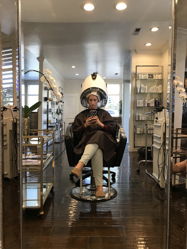 Photo of a woman in a hair salon. 