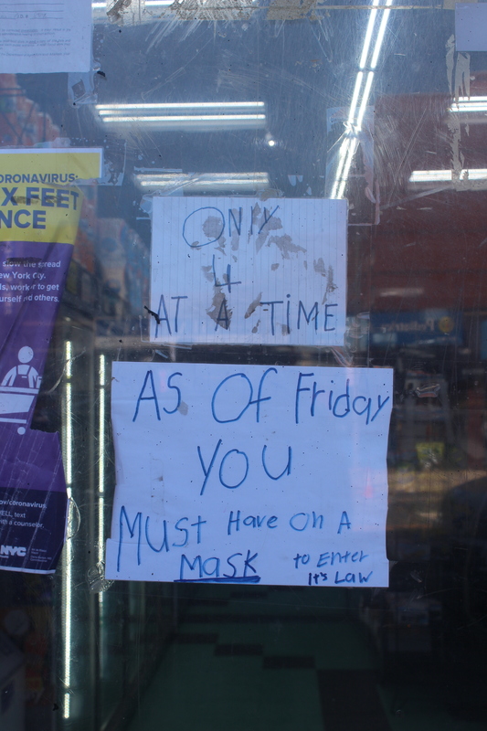 A sign in a glass window of a store. 