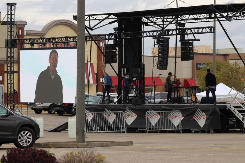 Photo of a stage in a parking lot.