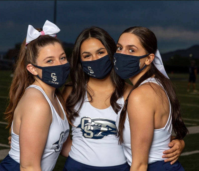 Three masked cheerleaders.