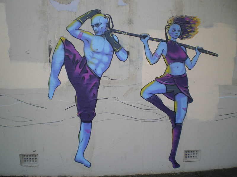 A mural with two people exercizing. 