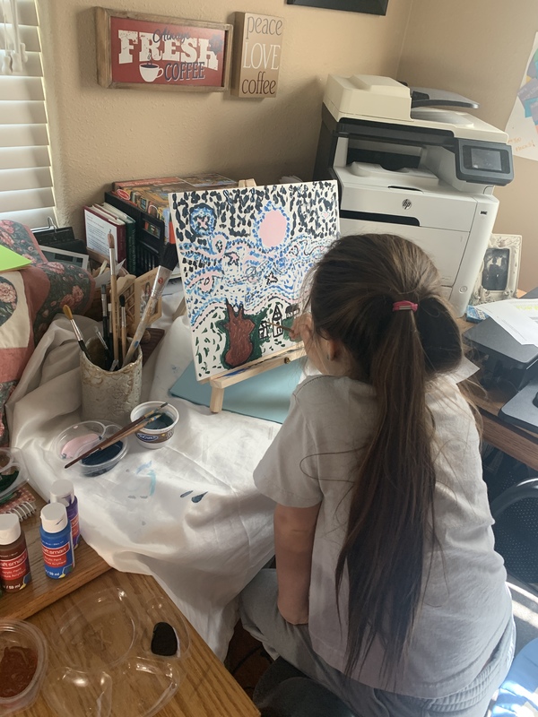 A photo of child painting.