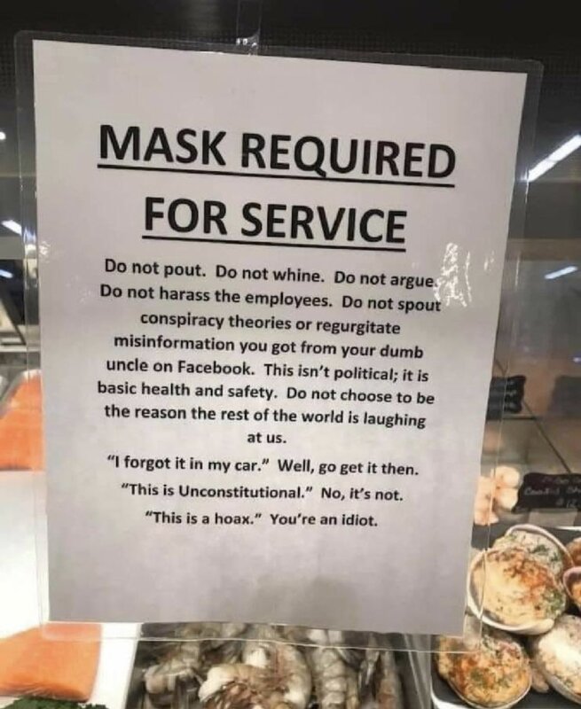 A business sign detailing mask wearing protocols for customers. 