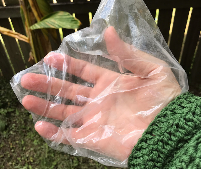 A hand in a plastic bag. 