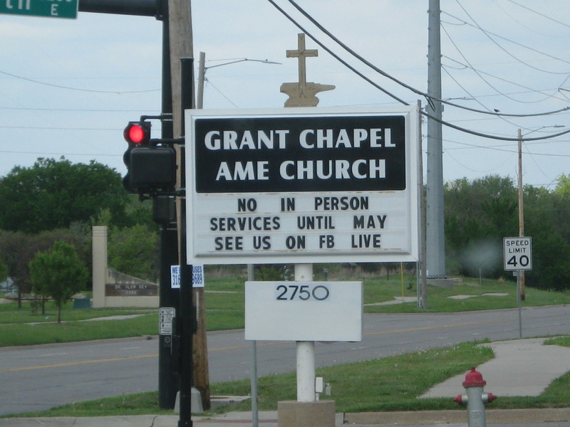 Image of a church billboard which says no in person services until May, see us on Facebook Live.