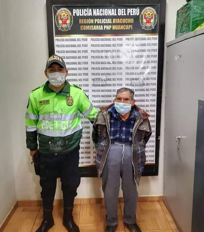 a police man and citizen standing next to each other both wearing masks 