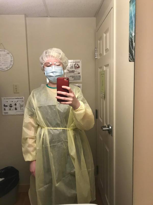 A healthcare worker in protective gear. 