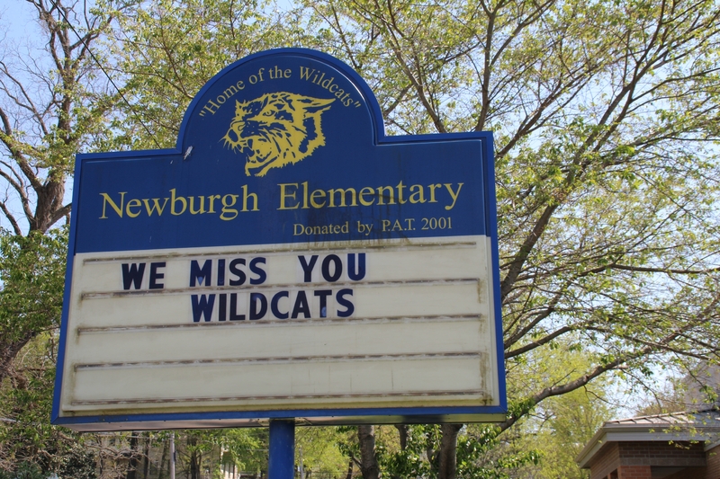 An elementary school sign reading "We Miss You Wildcats". 