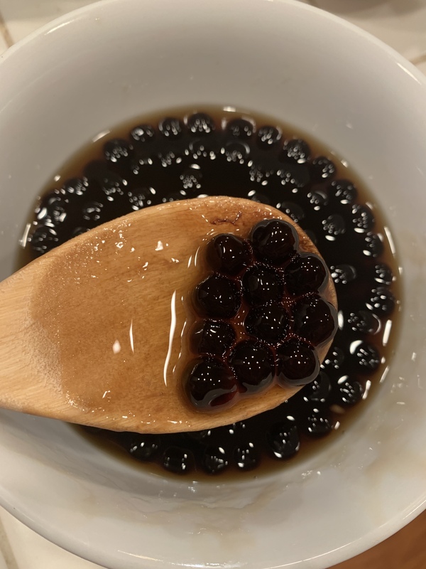 This is a picture of a bowl of Tapioca pearls, which are used as an ingredient in bubble tea. 