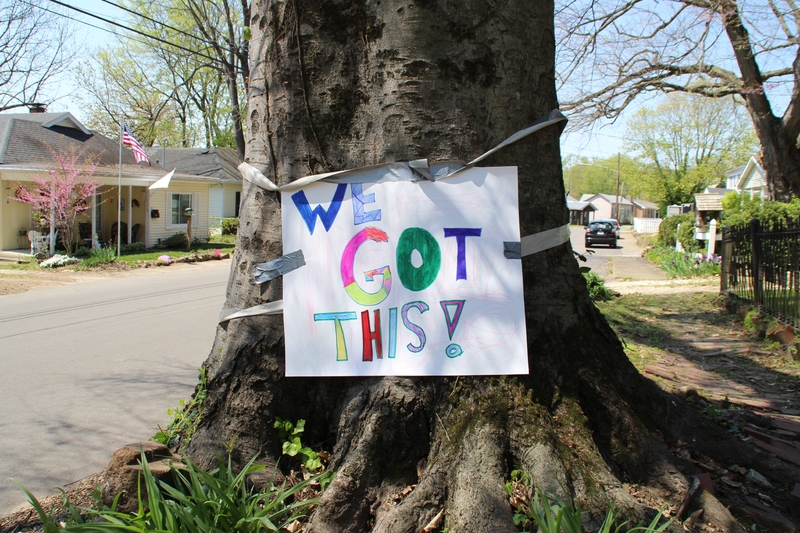 A paper sign reading "We got this".