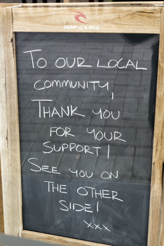 A chalkboard that talks about thanking their community. 