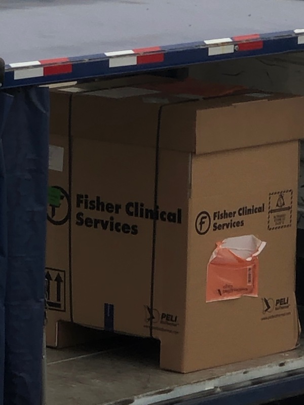 A cardboard box that says: "Fisher Clinical Services".