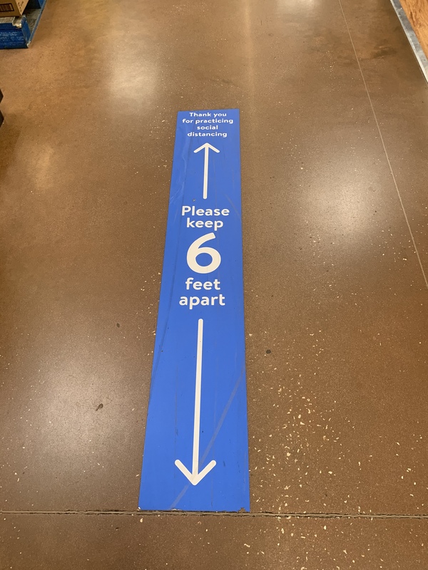 A blue sign on the floor. 