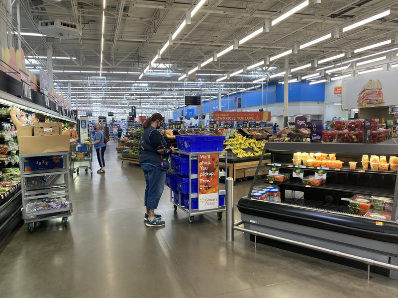 A photo of the inside of a Walmart grocery section. 