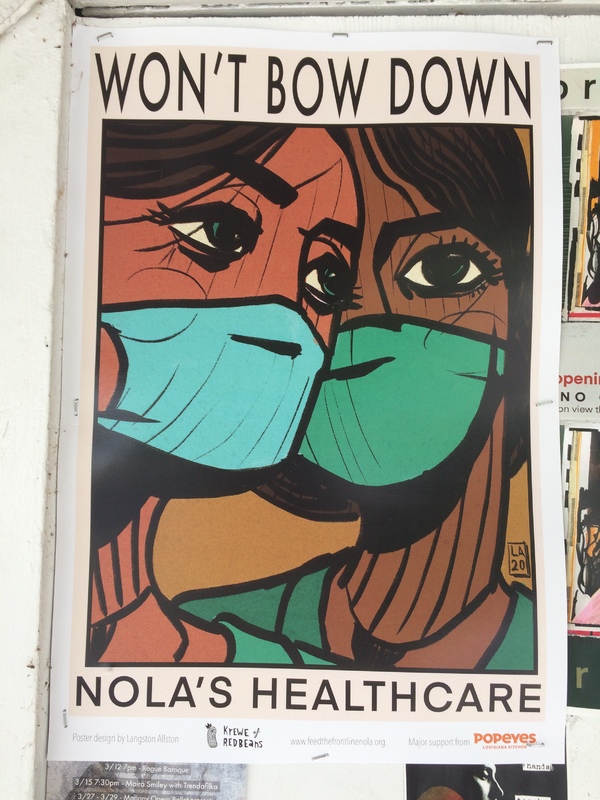 A poster of two healthcare workers with masks. 