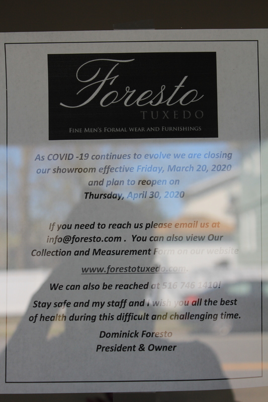 A sign for the business Foresta Tuxedo, it informs people that their showroom is closed due to the Coronavirus.