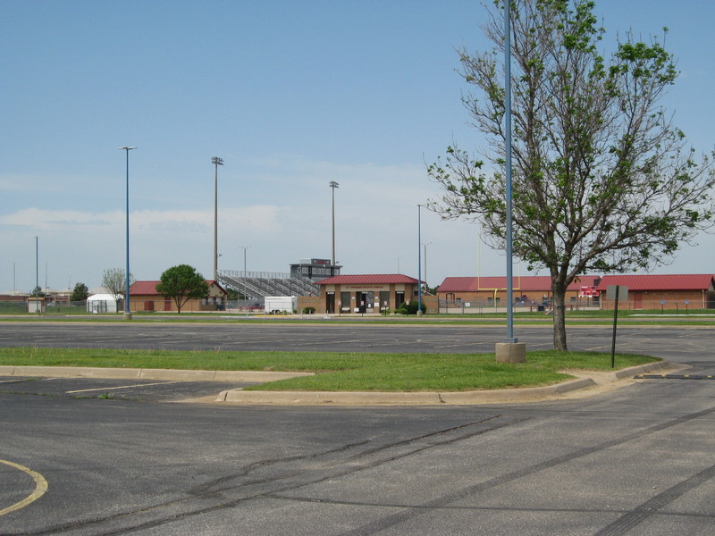 Image of an empty high school football stadium.