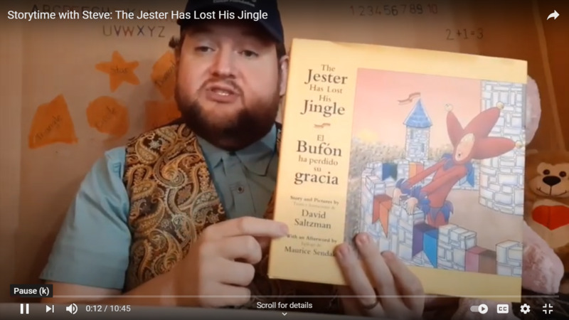 Screenshot of YouTube video.  Title is "Storytime with Steve: The Jester Has Lost His Jingle".  Man with beard holds up a children's book.