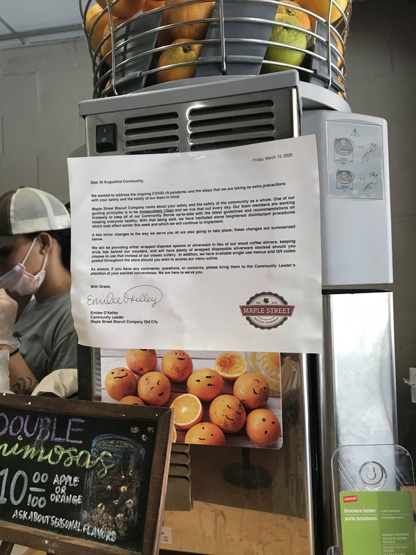 This is a picture of a letter that has been attached near the front counter of a restaurant which explains the adoption of local COVID-19 guidelines and policies to patrons.  