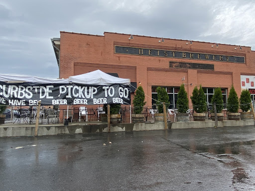 A tent that says "Curbside pickup to go" at Heist Brewery. 