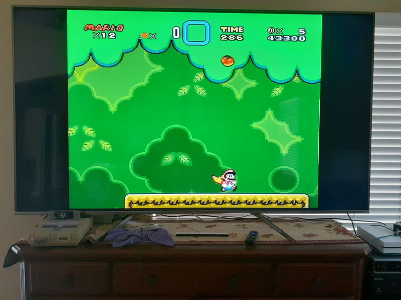 This is a picture of a TV with the video game Mario being played on it.