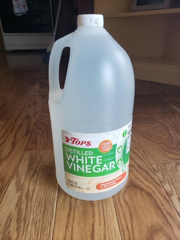 A jug of distilled white vinegar. 