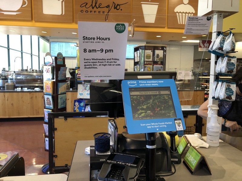 This is a picture taken of a Whole Foods self checkout counter. 