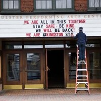 A local theater marquee reading "We are all in this together. Stay safe- be kind. We will be back! We are #Kingston".