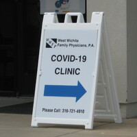 A sign directing towards a COVID-19 Clinic.