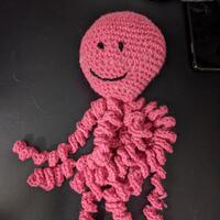 Crocheted pink octopus.