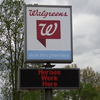 Sign outside a Walgreens reading "Heroes Work Here".