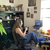 Image of a woman working from home.