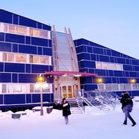 This is a picture of the legislature building of the town of Nunavut in Canada. The building is covered in snow. 