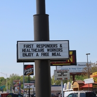 A  Sign reading "First Responders and Healthcare Workers Enjoy a Free Meal".