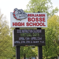 Sign at Benjamin Bosse High School reading "EVSC instruction calendar virtual days April 13 - April 23, April 27, April 29, and May 1".