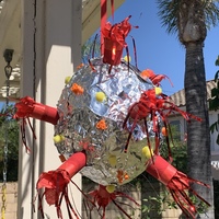 Photo of a pinata decorated to look like the COVID-19 virus.