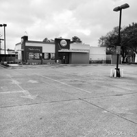 A Burger King with an empty parking lot. 