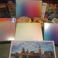 A picture of a collection of multiple puzzles. 