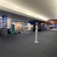 This is a picture taken of a deserted airport terminal. 