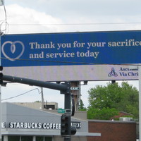 Billboard with a heart next to the words thank you for your sacrifice and service today.
