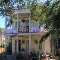 Home with sign that reads "God Bless our hometown heroes". 